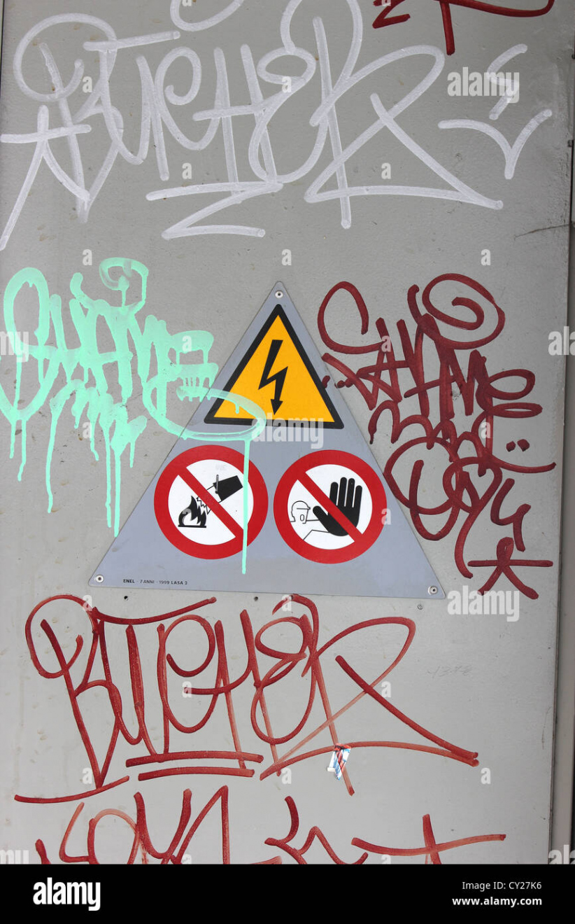 detail of metal industrial of door with graffiti tags and signs