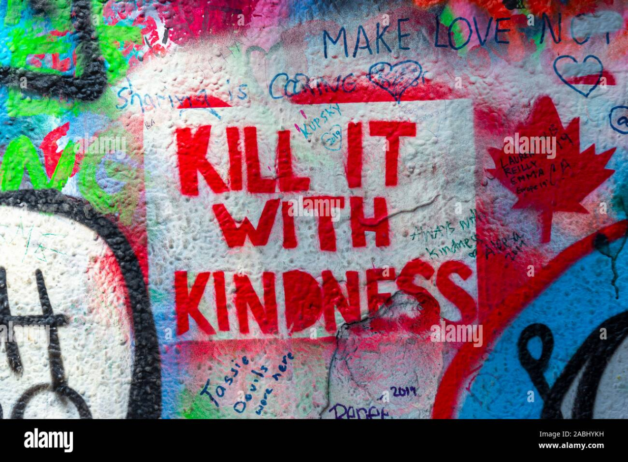 Kill it with Kindness, colourful graffiti on the John Lennon Wall