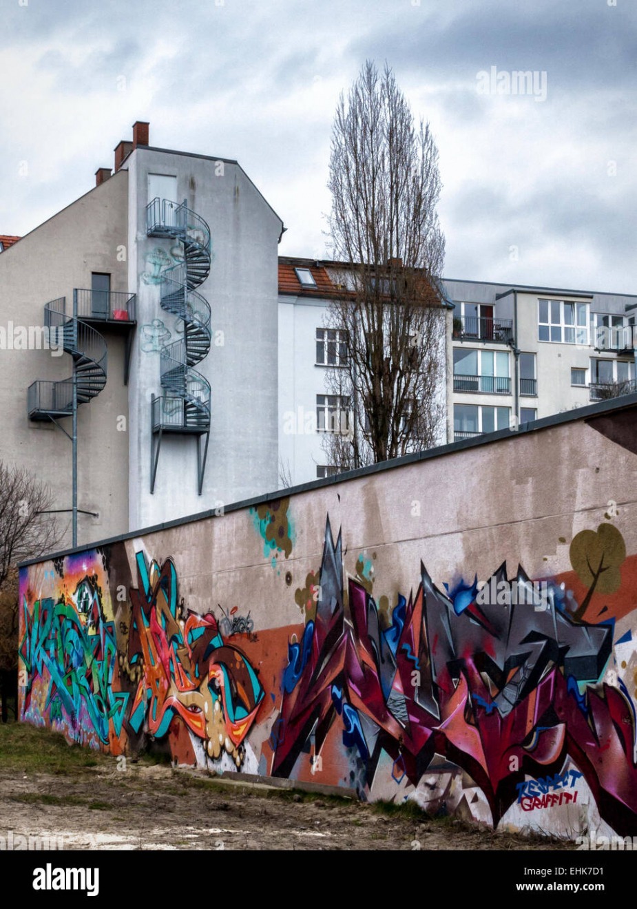 Street art murals and graffiti and apartment building with spiral