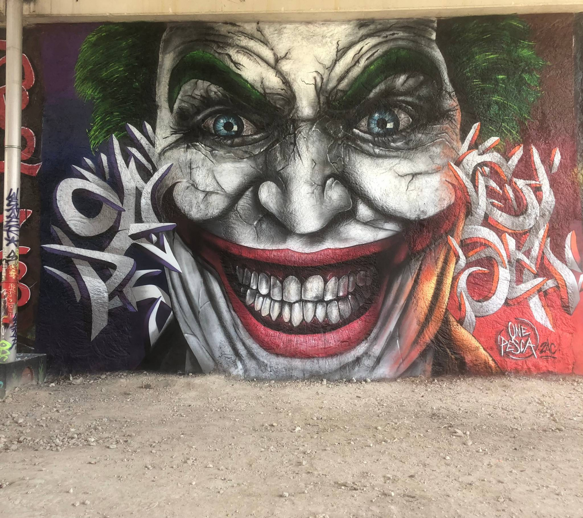 The Joker by One Pesca - Street Art Cities