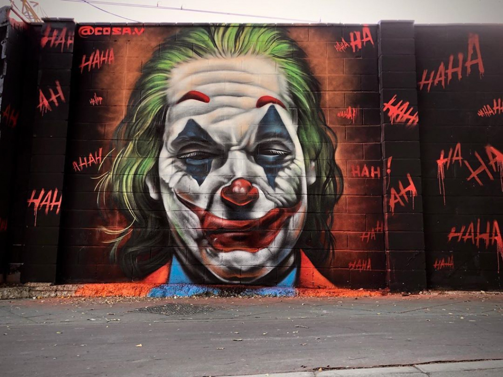 A gorgeous graffiti street art Joker Joaquin Phoenix from Joker