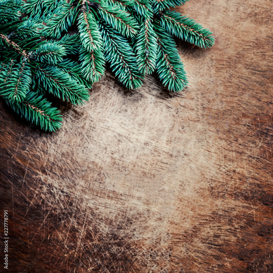 Christmas Background with fir tree branches on rustic wooden