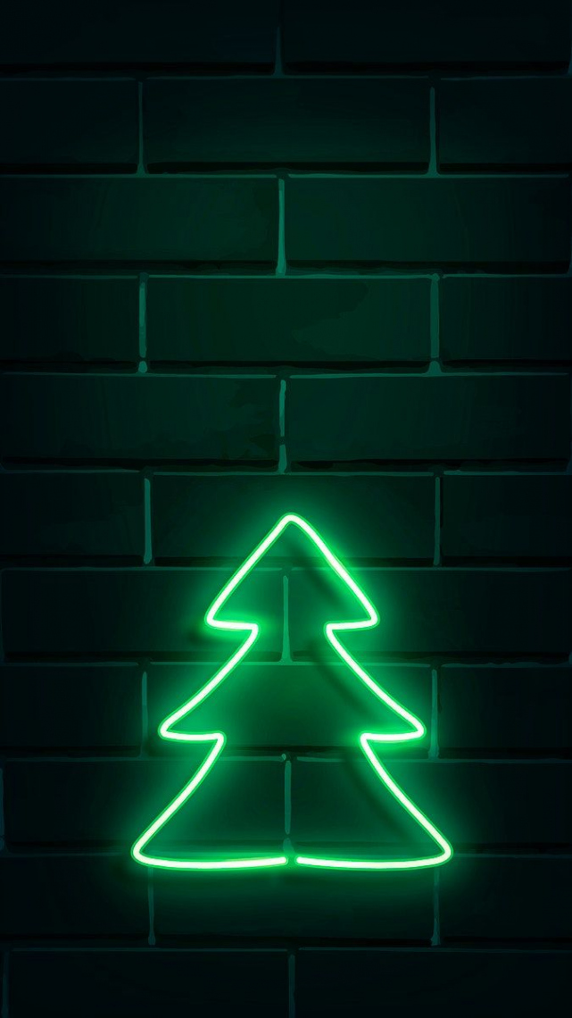 Christmas tree neon sign on a dark brick wall vector  premium