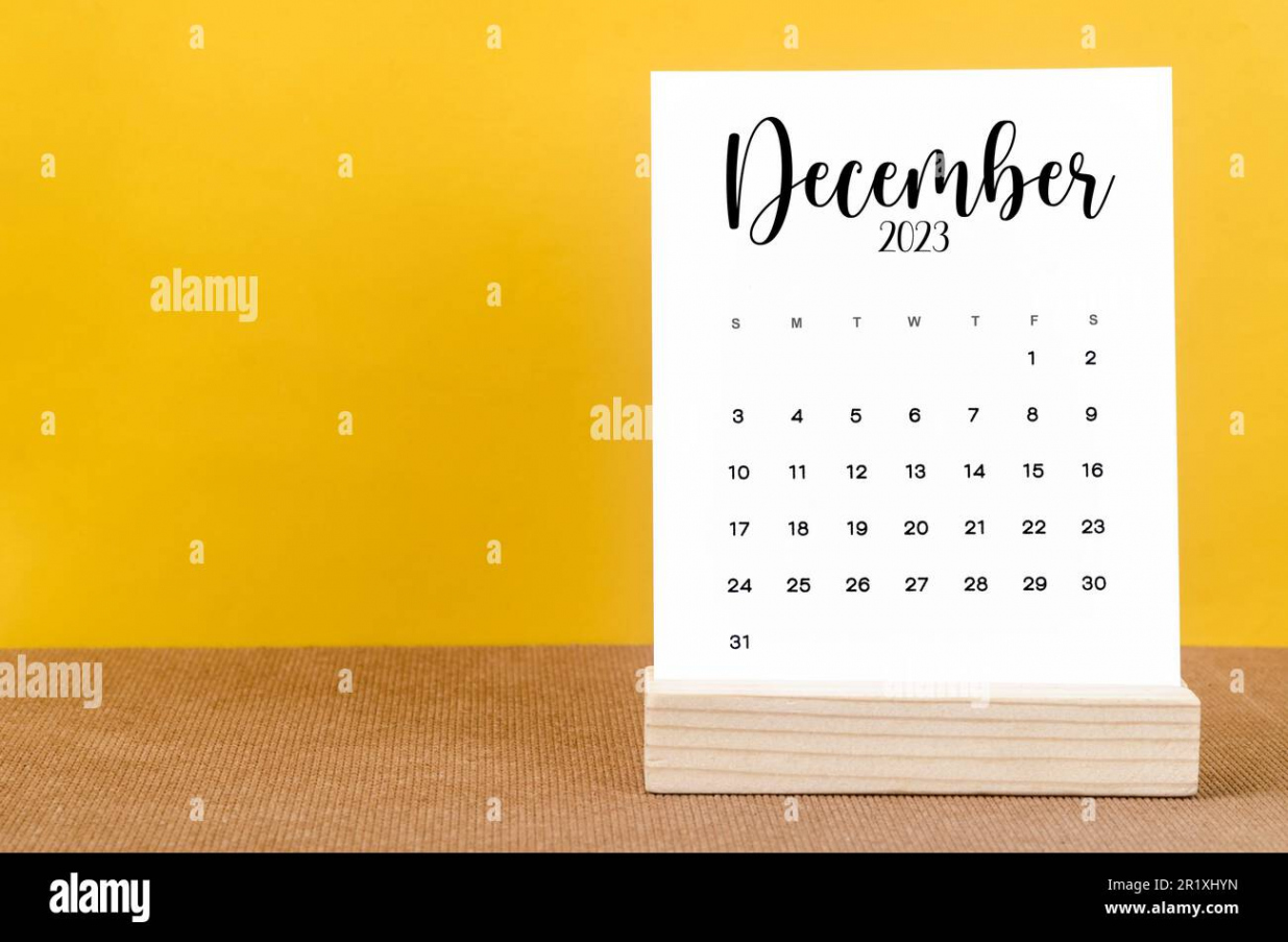 December  Monthly calendar for  year on yellow table Stock