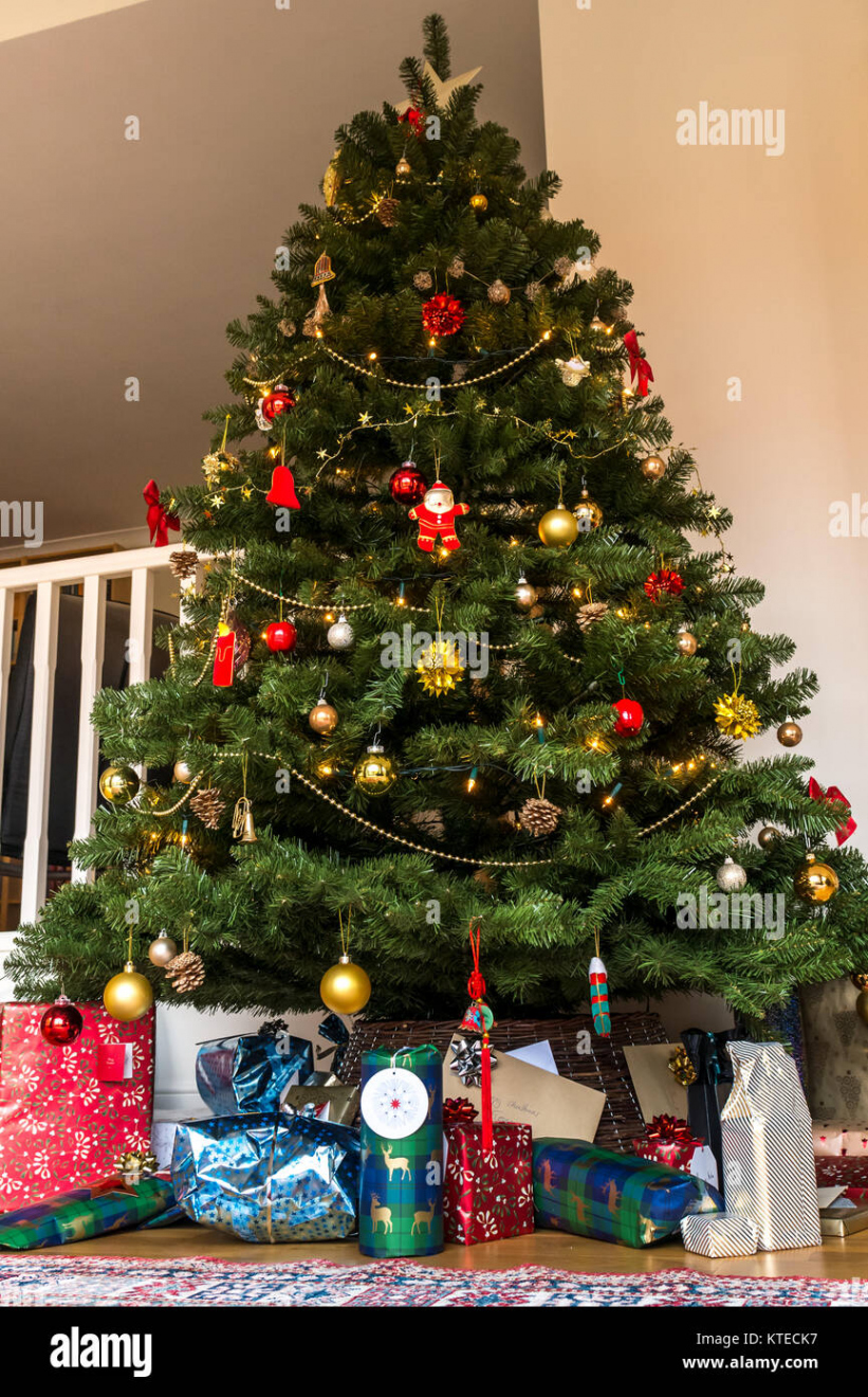 Presents under christmas tree hi-res stock photography and images